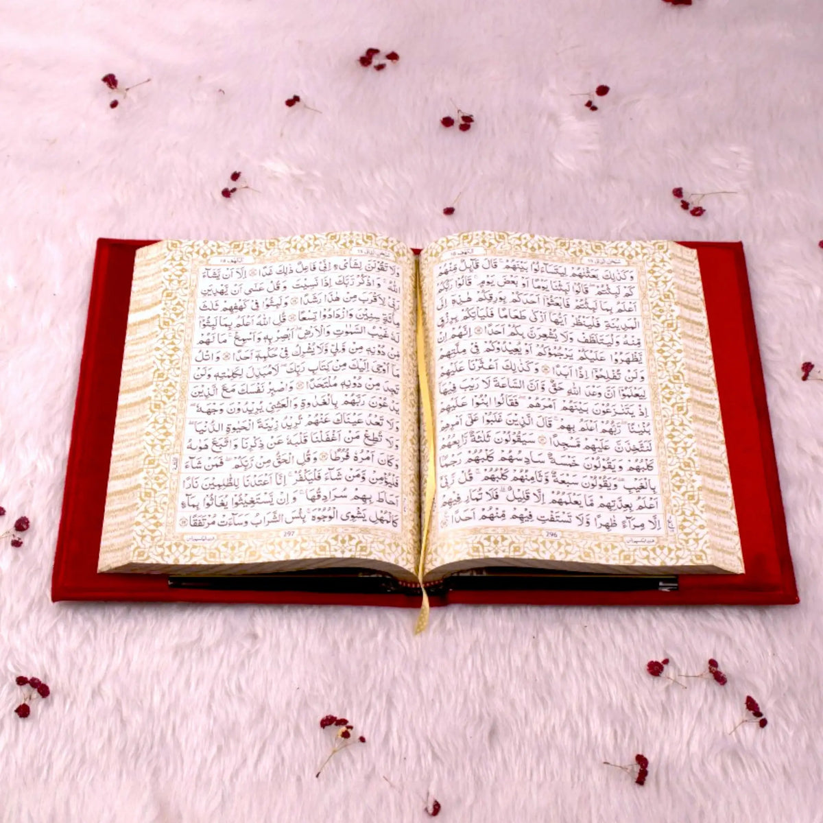 Open Quran with ornate golden border pages from the Maroon Sequence Rehal Hamper - Luxury Quran Gift Set. Luxurious Islamic gift edition.