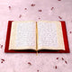Open Quran with ornate golden border pages from the Maroon Sequence Rehal Hamper - Luxury Quran Gift Set. Luxurious Islamic gift edition.