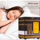 Woman sleeping with a white noise machine next to her