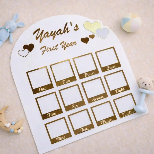 1 Year Baby Calendar Photo Frame | Photo Frames Online featuring 12 golden photo slots labeled by month for capturing baby milestones in nursery décor.