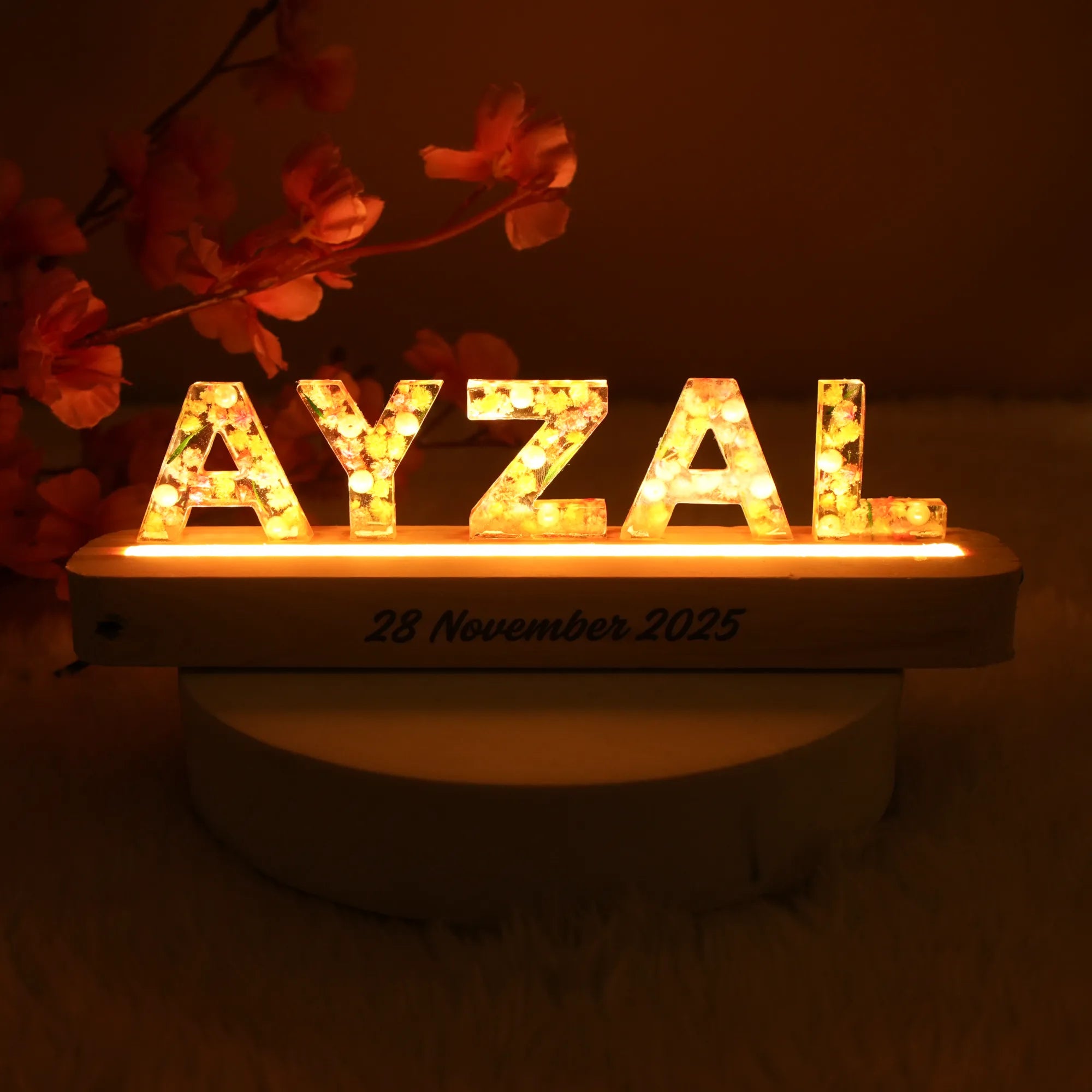 Buy Personalized LED Name Stand Online - Unique Decor Gift featuring the name 'AYZAL' illuminated with warm LED light on a wooden base, perfect for home decor. Main image