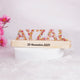Personalized LED Name Stand with floral resin letters 'AYZAL' on a wooden base engraved with a date, ideal for gifting and kids' room decoration.
