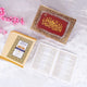 Quran box with gold and red design, pink flowers nearby
