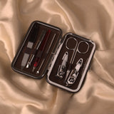 Luxury compact grooming kit with nail clippers, scissors, and tweezers in a brown leather case. Ideal for personal care during Hajj & Umrah.