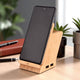 Smartphone docked on Maple 15W wireless charger & USB hub with pen stand, perfect for workspace charging and storage solutions.