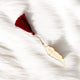 Feather Bookmark Bismillah featuring a deep red tassel, combining Islamic elegance with functionality for thoughtful gifting.
