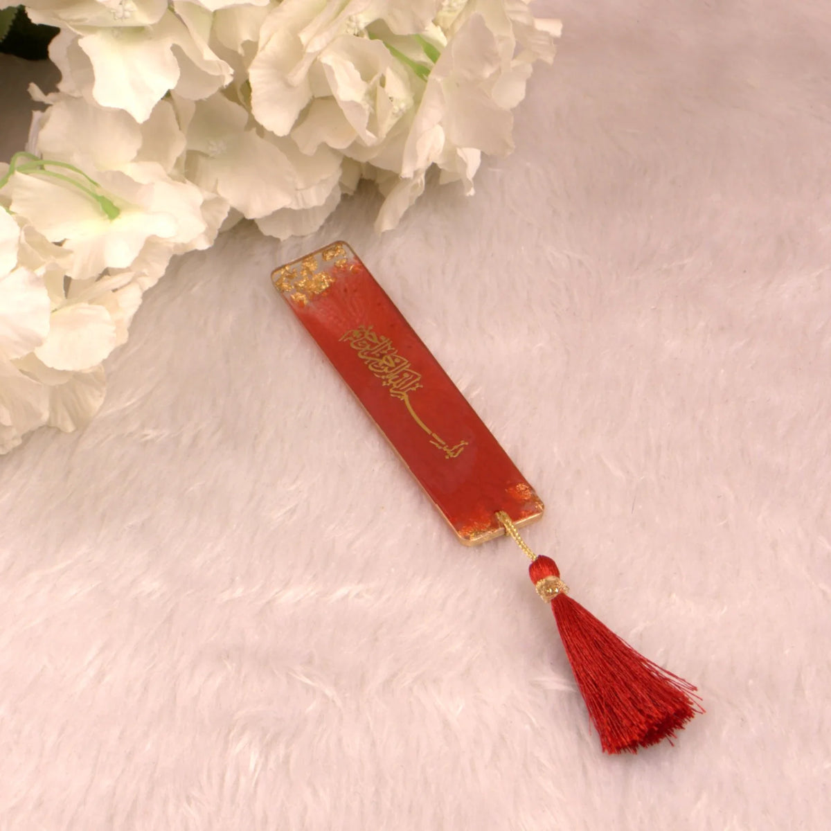 Maroon resin bookmark with tassel, included in the Maroon Flakes Bridal Hamper, ideal for Quran reading and bridal gift sets.