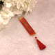 Maroon resin bookmark with tassel, included in the Maroon Flakes Bridal Hamper, ideal for Quran reading and bridal gift sets.