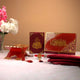 Elegant Maroon Flakes Bridal Hamper with Quran, Rehal, Tasbeeh, and prayer essentials, ideal for wedding gifts and Sawab-e-Jariya offerings.