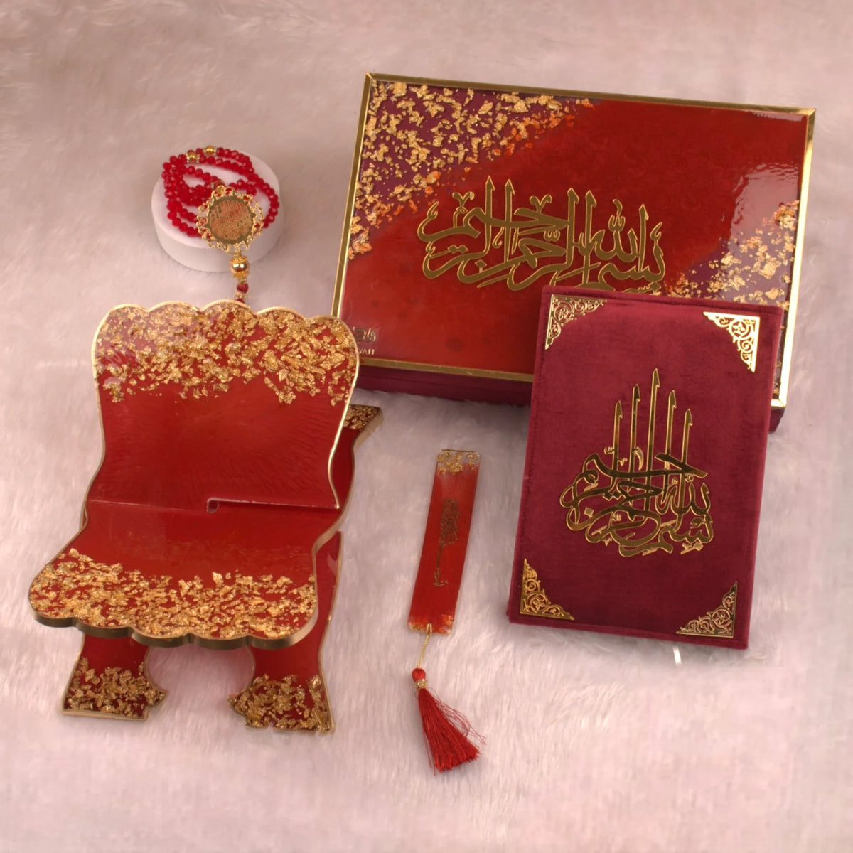 Top view of Maroon Flakes Rehal Hamper showing Quran, Rehal, tasbeeh, and bookmark in a luxurious maroon and gold finish. Elegant religious gift set.