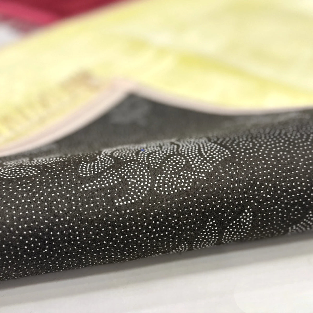 Underside of Offwhite Janamaz from Couple Prayer Set with non-slip dotted backing, ensuring stability during prayer rituals.