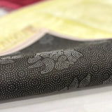 Underside of Offwhite Janamaz from Couple Prayer Set with non-slip dotted backing, ensuring stability during prayer rituals.