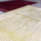 Detailed texture of Offwhite Janamaz from Couple Prayer Set, showcasing embossed Islamic patterns for spiritual elegance and comfort.