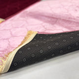Underside of pink Janamaz from Couple Dome Prayer Mat Set, showing anti-slip backing and golden fringe detail for added comfort.