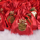 Red Nikah Favor Dry-Fruit Potlis with gold custom tags, handcrafted for elegant Muslim wedding gifts and party favors.