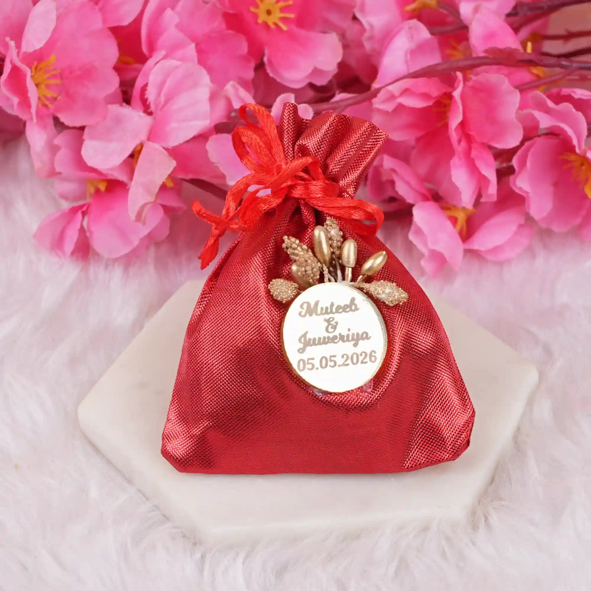 Handmade red Nikah Favor Dry-Fruit Potli with custom wedding date tag, perfect for unique Muslim marriage celebrations.