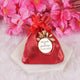 Handmade red Nikah Favor Dry-Fruit Potli with custom wedding date tag, perfect for unique Muslim marriage celebrations.