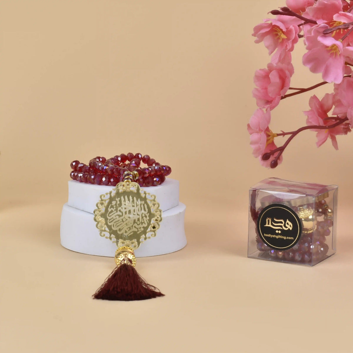 Customizable 100 Beads Crystal Tasbeeh in red with gold Islamic charm and maroon tassel, perfect for Islamic gifting and prayer rituals.