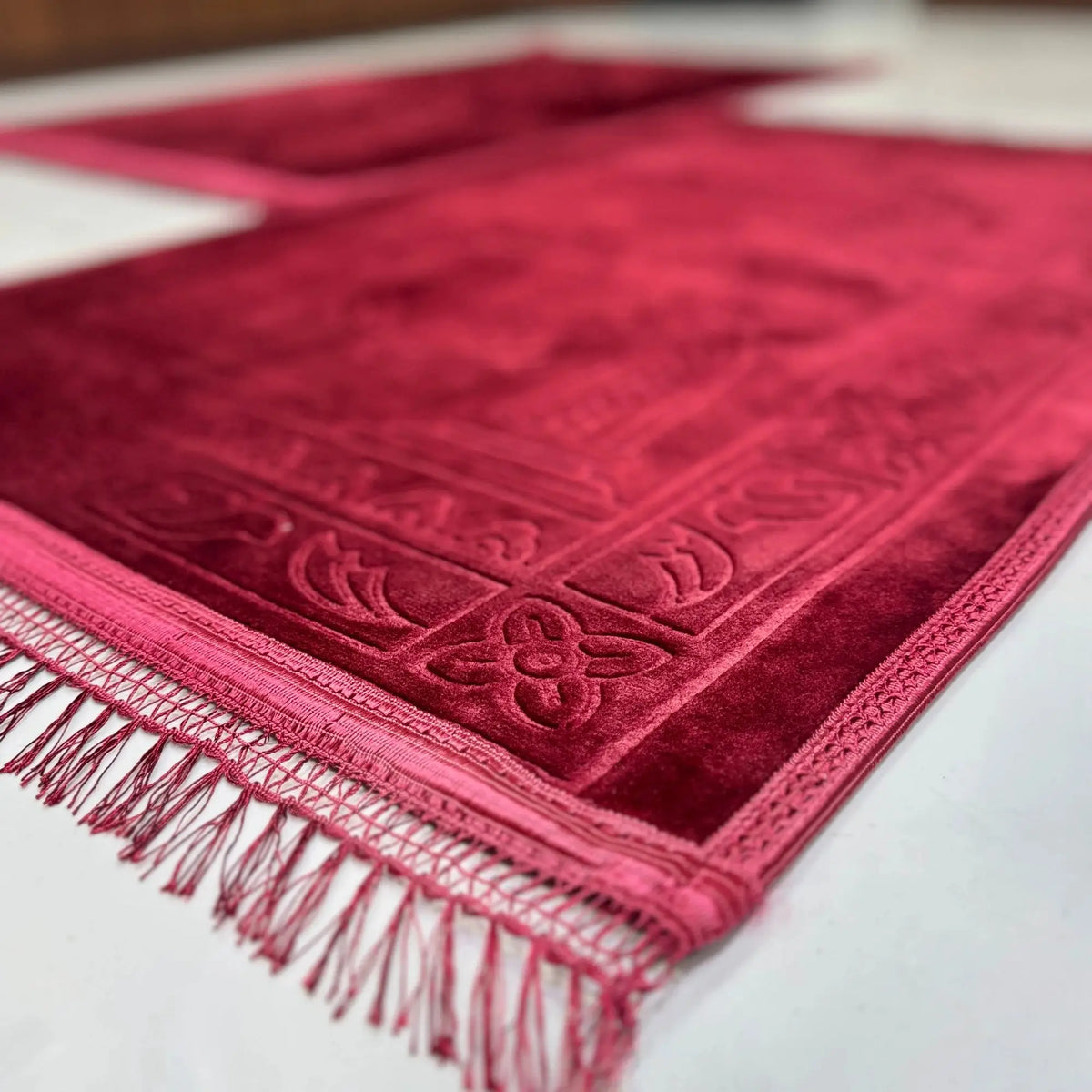Couple Janamaz Prayer Mat in maroon with heart design, made from soft durable fabric. Ideal Islamic wedding gift in rectangle shape.