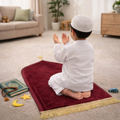 Maroon Kids Dome Janamaz - Kids Dome Prayer Rug shown with child in prayer. Lightweight and foldable, ideal for school or travel use.