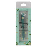 Packaged teal pen with 'Blooming Mogra' branding on a light green background