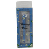 Blue pen in packaging with floral design and text on a white background