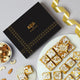 Premium Moong Dal Barfi with Desi Ghee topped with silver leaf, served on a plate beside a luxury gift box, perfect for weddings and Eid gifts.