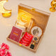 Gift set with Ramadan-themed items including a lamp, cards, and candies in a wooden box.