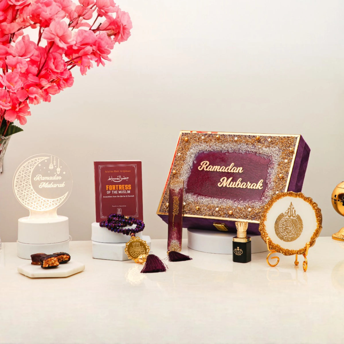 Premium Ramadan Gift Box by Mubarak Moments in purple with spiritual items like tasbeeh, ittar, and Islamic decor. Ideal festive hamper.