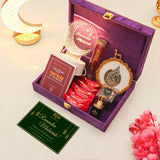 Open purple gift box containing Ramadan-themed items on a light background