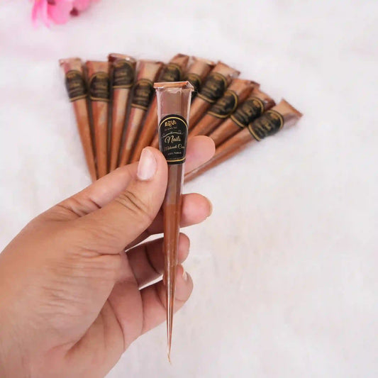 Single cone from Nail Mehndi Cones - Pack of 12 held in hand, ideal for precise nail and finger detailing in bridal and festive designs.