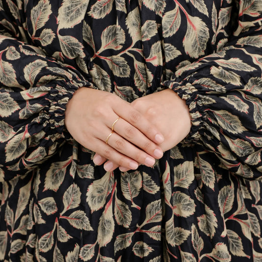 Close-up of hands with a floral patterned garment