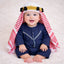 Baby boy in traditional attire with red and white headscarf