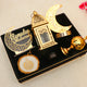Top view of Nazakat Luxury Ramadan Hamper with decorative moon lamp, lantern, and Islamic calligraphy plaque in a velvet tray for Ramadan celebrations.