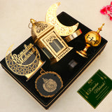 Nazakat Luxury Ramadan Hamper with moon lamp, gold lantern, and Islamic decor in a velvet tray, includes a Ramadan Mubarak greeting card for gifting.