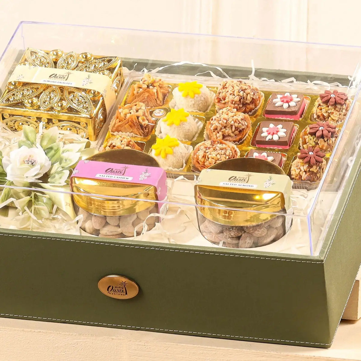 Close-up of Nazrana-e-Tohfa Set featuring gourmet sweets, nuts, and elegant jars in a premium green gift box for festive gifting.