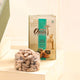 Nazrana-e-Tohfa Set includes a jar of chocolate-coated almonds and a luxury Arabian sweets booklet, perfect for gourmet gift hampers.