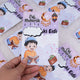 A hand holding a purple premium Eidi card for boys, highlighting the blank cloud space for personalizing the recipient's name.