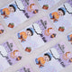 Multiple purple Eid Mubarak Eidi cards for boys scattered on a fluffy surface, featuring a cartoon boy reading, a crescent moon, and a wallet.