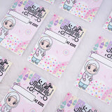 Multiple pink premium Eid Mubarak Eidi cards for girls scattered on a white fluffy background.