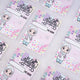 Multiple pink premium Eid Mubarak Eidi cards for girls scattered on a white fluffy background.