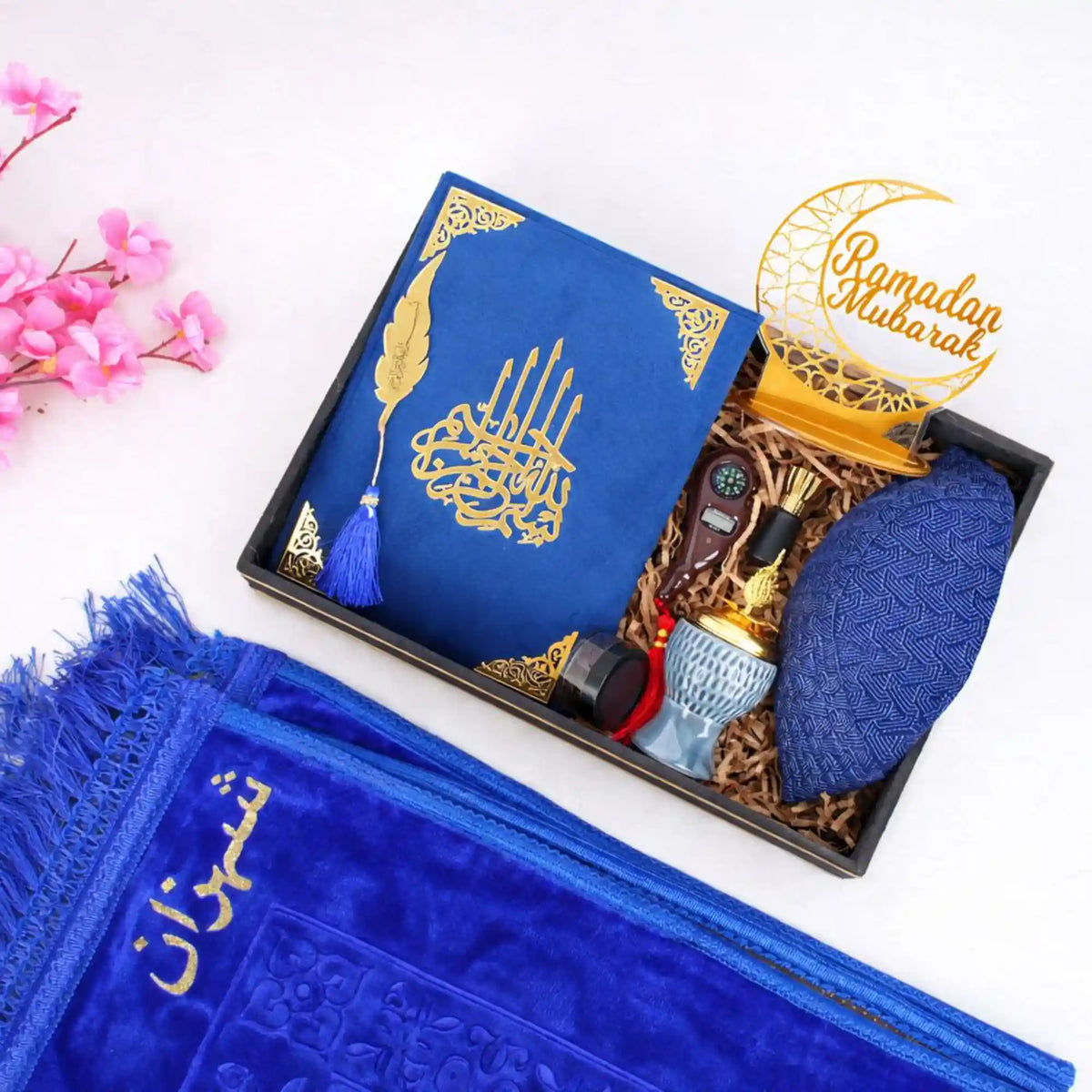 Taqwa Ramadan Men's Hamper in royal blue, displaying a velvet Kaaba Quran, patterned kufi, bakhoor burner, attar, digital tasbeeh, Ramadan Mubarak stand, and a matching blue velvet janamaz.
