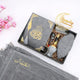 Taqwa Ramadan Men's Hamper in silver grey, showcasing a velvet Kaaba Quran, patterned kufi, bakhoor burner, attar, digital tasbeeh, Ramadan Mubarak stand, and a matching grey velvet prayer mat.