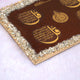 Close-up of Red Stone Islamic Frame showing golden 4 Qul Surahs and crystal-studded border, a luxurious Islamic gift and decor piece.