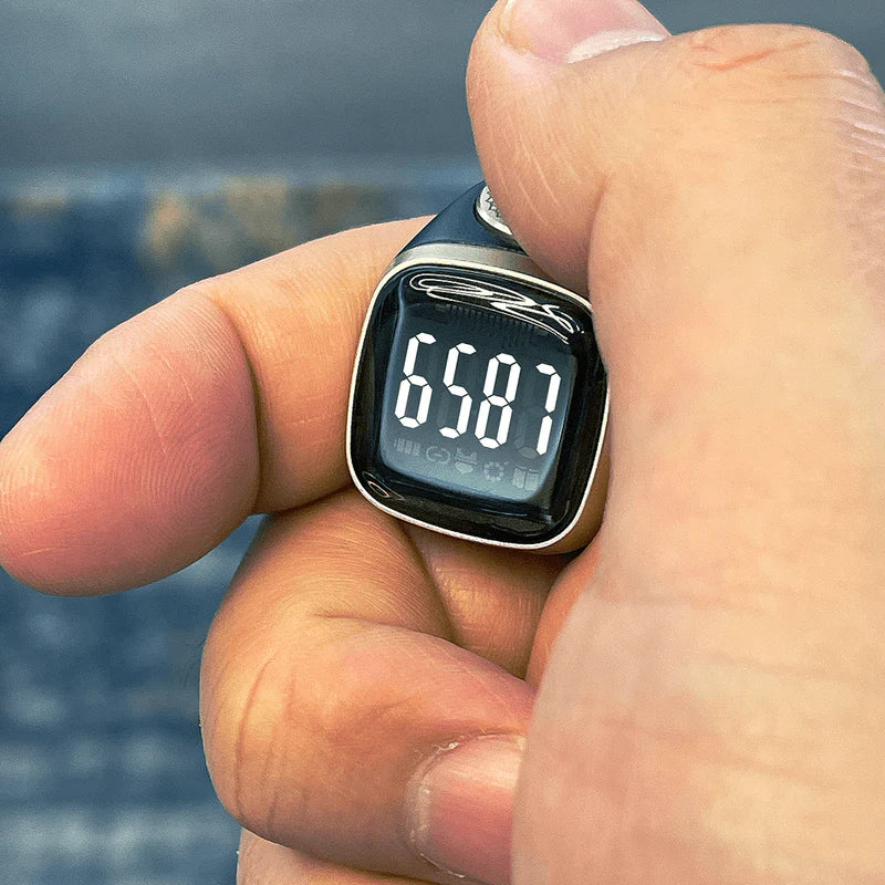 Close-up of Noor Zikr Ring 2.0 showing 6581 zikr count on bright digital display, ideal for prayer reminders.