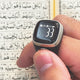 Noor Zikr Ring 2.0 in use during Quran reading, showing zikr count of 33 on digital screen for prayer tracking.