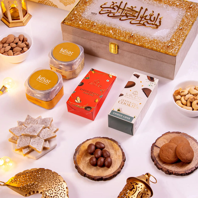 Noor Al-Lazeez Sweet Collection - Traditional Sweets | Designer Box, Handmade featuring Kaju Katli, cookies, nuts, and choco almonds in a festive setup. Main image