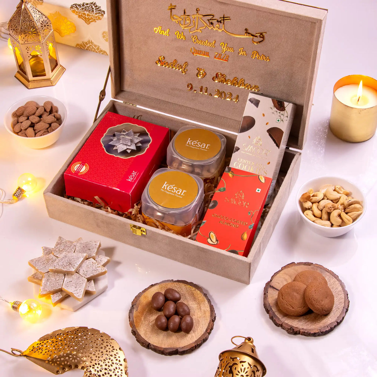 Open Noor Al-Lazeez Sweet Collection designer box with traditional sweets like Kaju Katli, cookies, and nuts, ideal for gifting on special occasions.