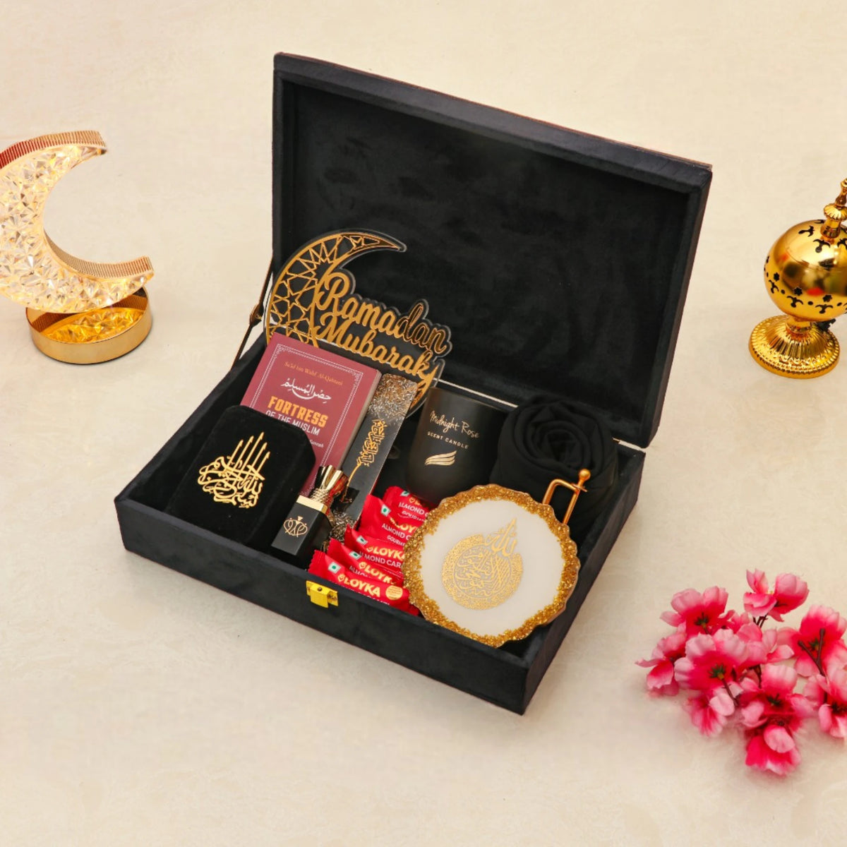 Open Noor Al-Ramadan Gift Box in black with prayer essentials, hijab, and candle, ideal for religious Ramadan gifts.