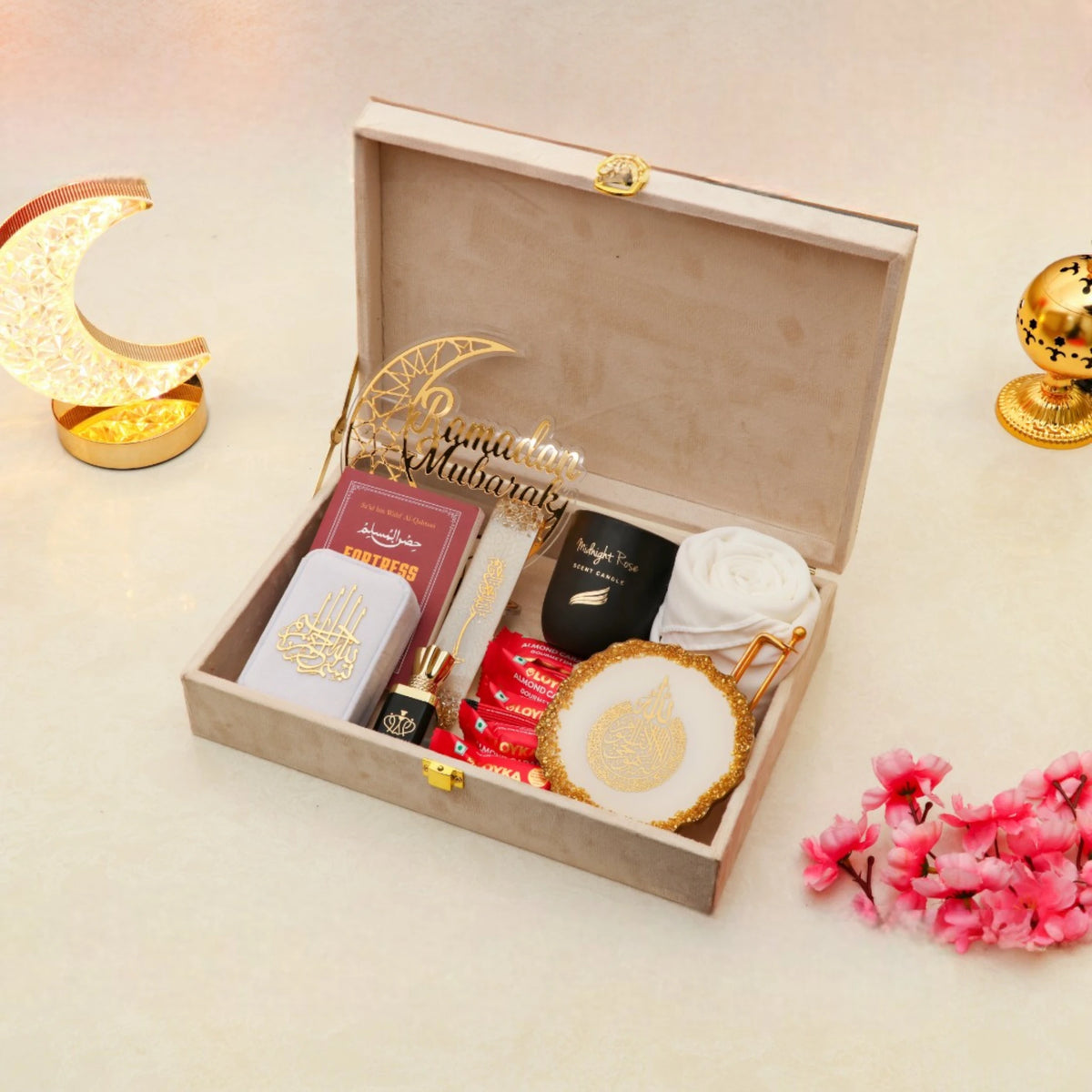 Ramadan Gift Box open with essentials like tasbeeh, hijab, candle, and decor, beautifully arranged for festive gifting.